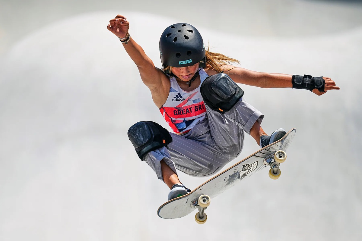 Skateboarder grabbing air on a ramp